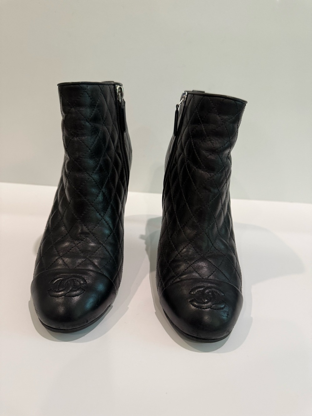 CHANEL Black Quilted Leather Ankle Booties with Embossed CC